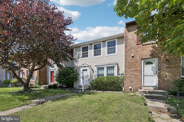 9228 Pinenut Ct, Laurel, MD 20723 - view of front of house featuring a front yard, entry steps, and brick siding
