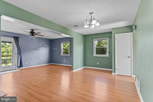 1142 Pheasant Dr N, Carlisle, PA 17013 - empty room with a chandelier, light wood finished floors, and ceiling fan