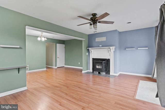 1142 Pheasant Dr N, Carlisle, PA 17013 - unfurnished living room with wood finished floors, ceiling fan, and a chandelier