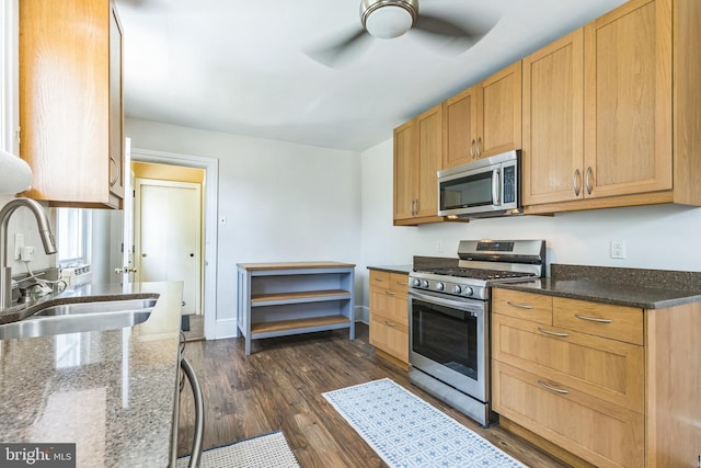 250 Maple Ave, Glenside, PA 19038 - kitchen featuring stainless steel appliances, ceiling fan, dark wood-style floors, and dark stone counters