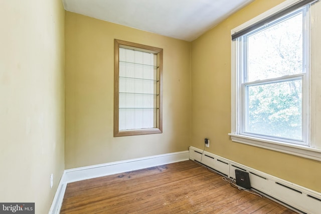 250 Maple Ave, Glenside, PA 19038 - spare room with baseboard heating, wood finished floors, and healthy amount of natural light