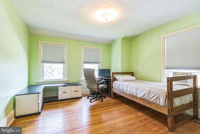 250 Maple Ave, Glenside, PA 19038 - bedroom with light wood-style floors, an office area, and cooling unit