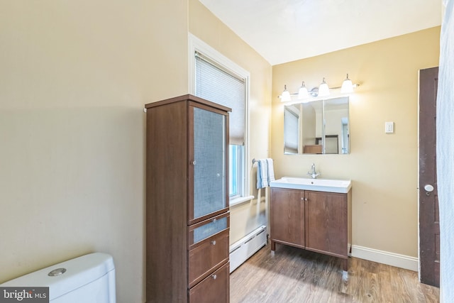 250 Maple Ave, Glenside, PA 19038 - bathroom with a baseboard radiator, vanity, and wood finished floors