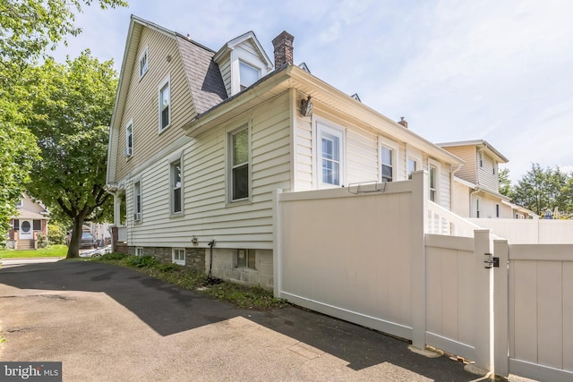 250 Maple Ave, Glenside, PA 19038 - view of home's exterior featuring a chimney and a gate