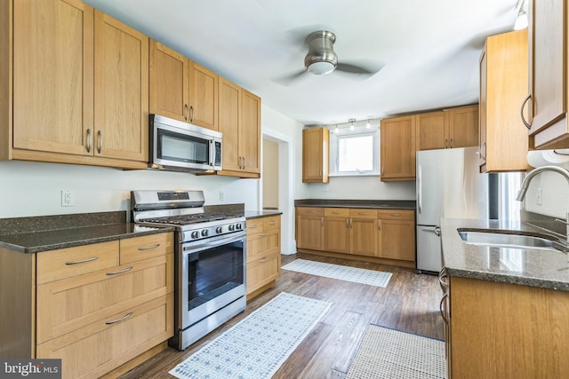 250 Maple Ave, Glenside, PA 19038 - kitchen with stainless steel appliances, ceiling fan, wood finished floors, and dark stone countertops