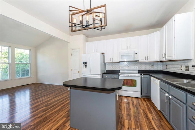 1724 Derrs Sq E, Frederick, MD 21701 - kitchen with white appliances, dark countertops, gray cabinetry, vaulted ceiling, and dark wood finished floors