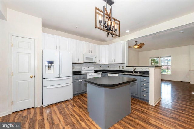 1724 Derrs Sq E, Frederick, MD 21701 - kitchen with white appliances, gray cabinetry, dark countertops, dark wood-type flooring, and white cabinetry