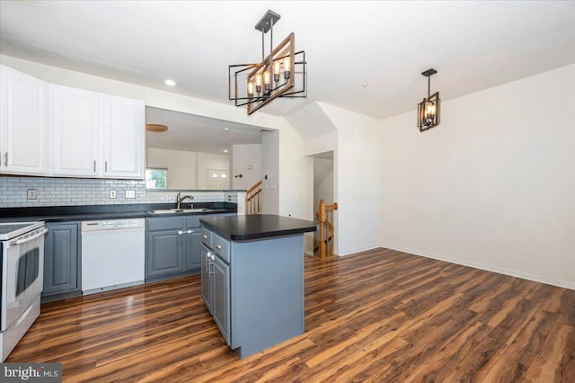1724 Derrs Sq E, Frederick, MD 21701 - kitchen featuring white appliances, dark countertops, dark wood-style flooring, a center island, and recessed lighting