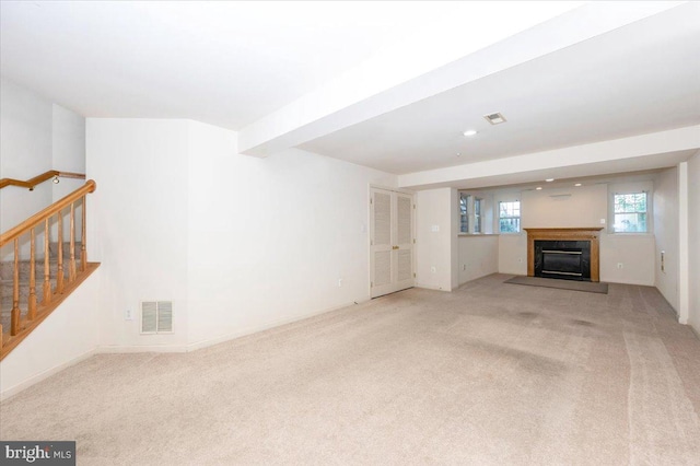 1724 Derrs Sq E, Frederick, MD 21701 - unfurnished living room with carpet, a glass covered fireplace, stairs, and recessed lighting
