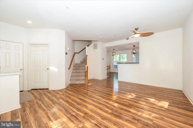 1724 Derrs Sq E, Frederick, MD 21701 - unfurnished living room featuring wood finished floors, a ceiling fan, and stairs