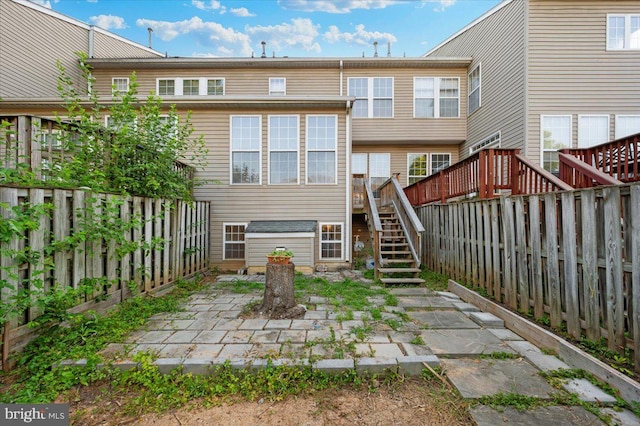 1724 Derrs Sq E, Frederick, MD 21701 - rear view of house with stairs, a fenced backyard, a patio, and a deck