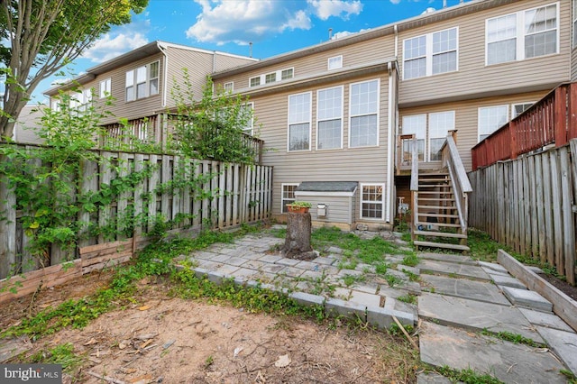 1724 Derrs Sq E, Frederick, MD 21701 - rear view of house with stairway, a fenced backyard, and a wooden deck