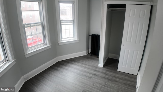 31 Maple Ave, Trenton, NJ 08618 - unfurnished bedroom featuring radiator heating unit, dark wood finished floors, and a closet