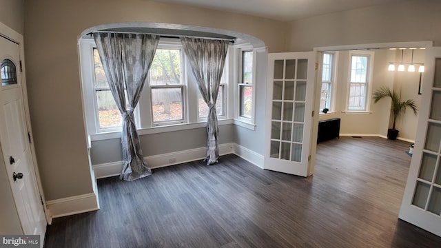 31 Maple Ave, Trenton, NJ 08618 - foyer featuring arched walkways, dark wood finished floors, and healthy amount of natural light