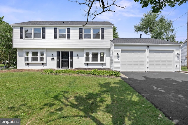 4 New Coach Ln, Willingboro, NJ 08046 - colonial-style house featuring an attached garage, asphalt driveway, and a front yard