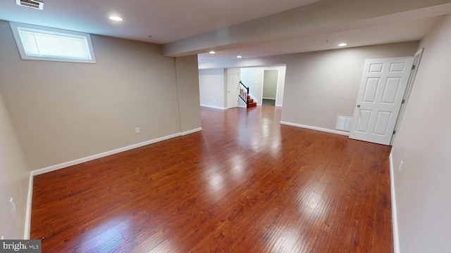 8117 Grayden Ln, Brandywine, MD 20613 - below grade area featuring wood finished floors, recessed lighting, and stairway