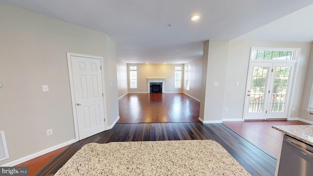 8117 Grayden Ln, Brandywine, MD 20613 - unfurnished living room with dark wood-type flooring, a fireplace with flush hearth, and recessed lighting