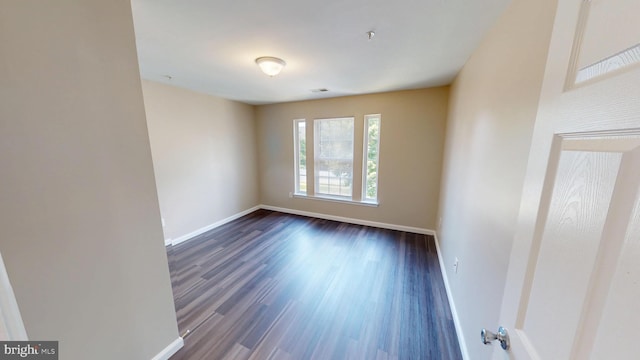 8117 Grayden Ln, Brandywine, MD 20613 - spare room featuring baseboards and dark wood-style flooring