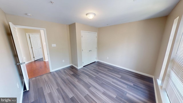 8117 Grayden Ln, Brandywine, MD 20613 - unfurnished bedroom with dark wood-style floors and a closet