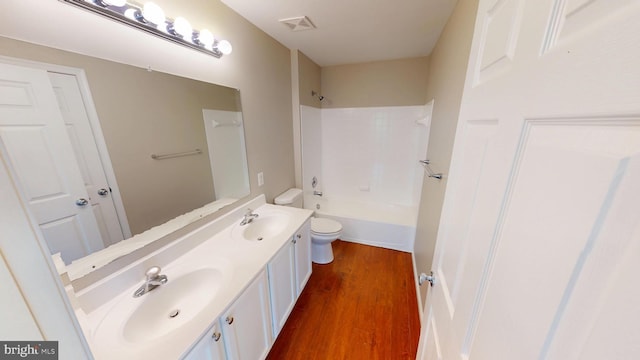 8117 Grayden Ln, Brandywine, MD 20613 - full bath with double vanity, wood finished floors, and shower / tub combination