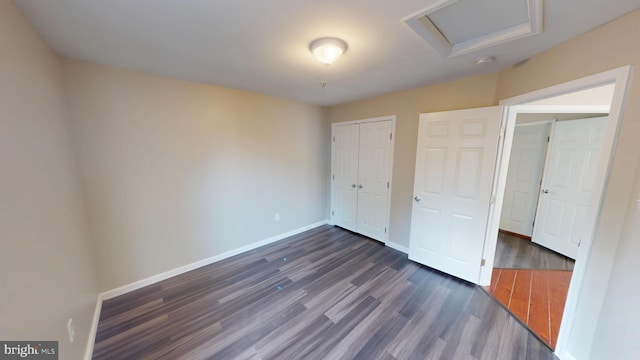 8117 Grayden Ln, Brandywine, MD 20613 - unfurnished bedroom featuring dark wood-style floors, a closet, and attic access