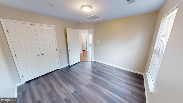 8117 Grayden Ln, Brandywine, MD 20613 - unfurnished bedroom with attic access, dark wood-style flooring, and a closet