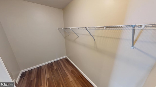 8117 Grayden Ln, Brandywine, MD 20613 - spacious closet featuring dark wood-style floors