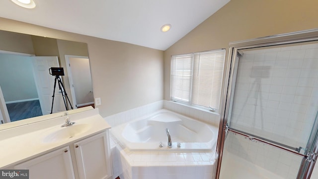 8117 Grayden Ln, Brandywine, MD 20613 - bathroom with vanity, a bath, recessed lighting, vaulted ceiling, and a shower stall