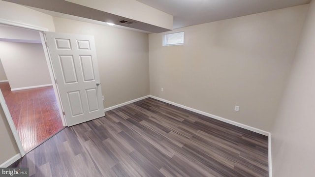 8117 Grayden Ln, Brandywine, MD 20613 - below grade area with dark wood-style flooring and baseboards