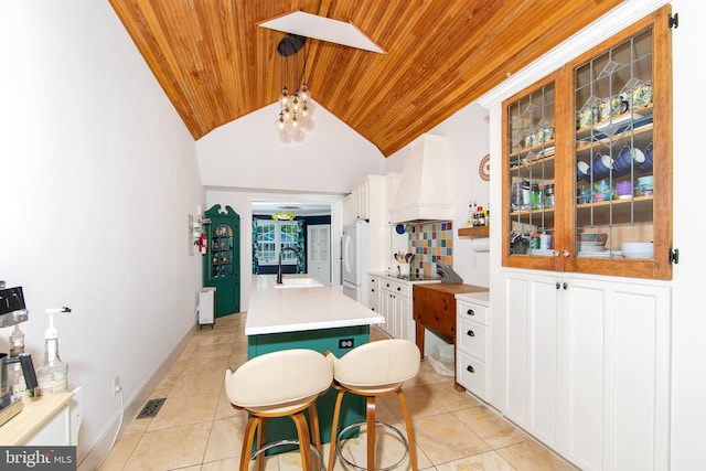 14 Utah Ave, Cherry Hill, NJ 08002 - kitchen with wooden ceiling, premium range hood, a center island with sink, light tile patterned floors, and white cabinets