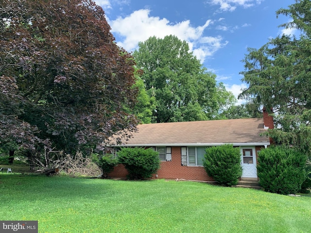 2142 Flag Marsh Rd, Mount Airy, MD 21771 - ranch-style house featuring a front lawn, a chimney, and brick siding