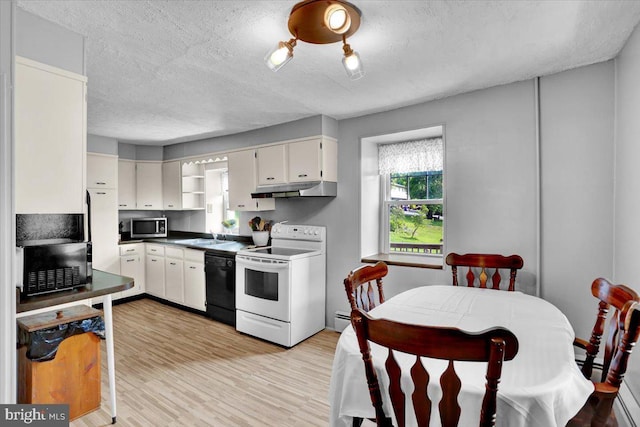 1124 Fairview Dr, Reading, PA 19605 - kitchen featuring electric range, stainless steel microwave, under cabinet range hood, black dishwasher, and open shelves