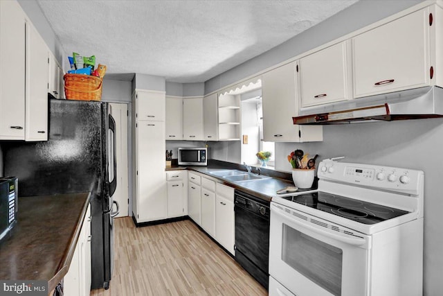 1124 Fairview Dr, Reading, PA 19605 - kitchen with black appliances, under cabinet range hood, open shelves, dark countertops, and light wood-style flooring