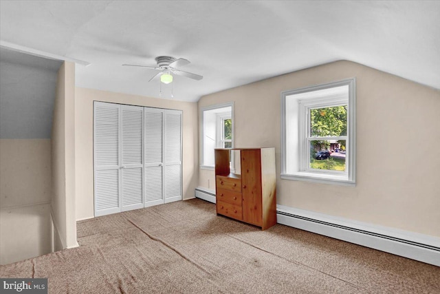 1124 Fairview Dr, Reading, PA 19605 - unfurnished bedroom featuring a baseboard heating unit, carpet flooring, a closet, lofted ceiling, and a ceiling fan