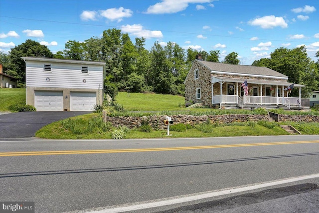 1124 Fairview Dr, Reading, PA 19605 - view of front facade with asphalt driveway, covered porch, a chimney, a garage, and a front yard