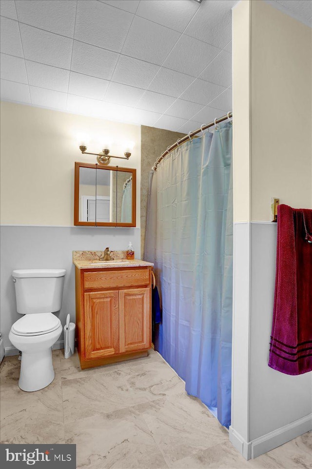 1124 Fairview Dr, Reading, PA 19605 - bathroom with vanity, marble finish floors, a shower with shower curtain, and a drop ceiling
