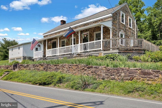 1124 Fairview Dr, Reading, PA 19605 - view of front of house with covered porch, stone siding, and a chimney
