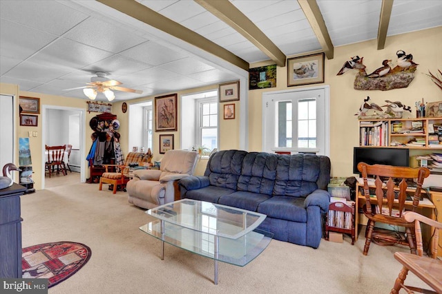 1124 Fairview Dr, Reading, PA 19605 - carpeted living area featuring plenty of natural light, a ceiling fan, and beamed ceiling