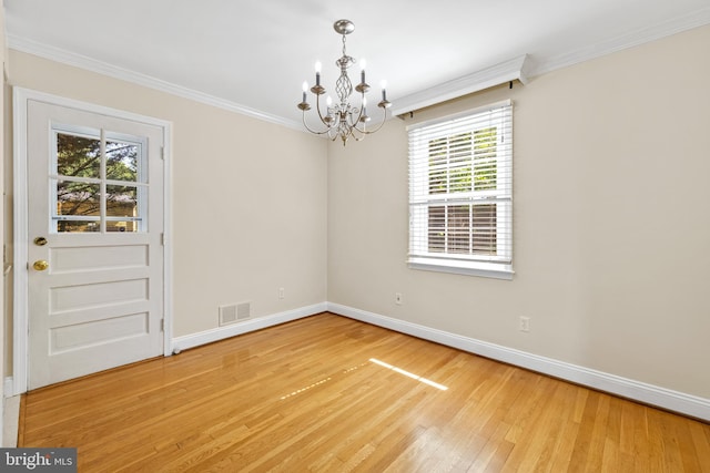 1516 Berwick Rd, Baltimore, MD 21204 - unfurnished room with a chandelier, plenty of natural light, light wood-style floors, and ornamental molding