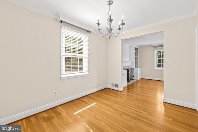 1516 Berwick Rd, Baltimore, MD 21204 - unfurnished dining area with a chandelier, ornamental molding, light wood-type flooring, and built in features