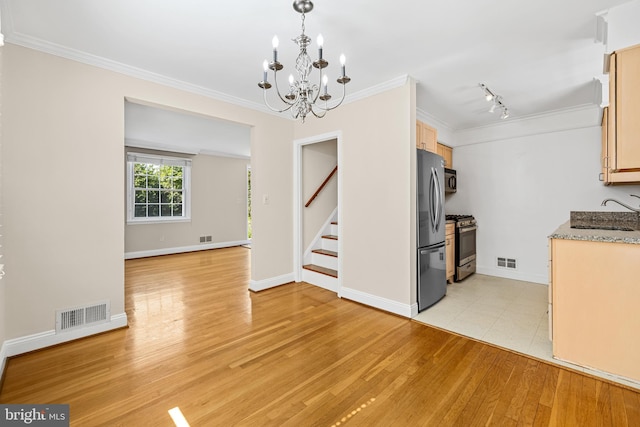 1516 Berwick Rd, Baltimore, MD 21204 - kitchen with stainless steel appliances, a chandelier, light wood-style floors, ornamental molding, and light stone counters