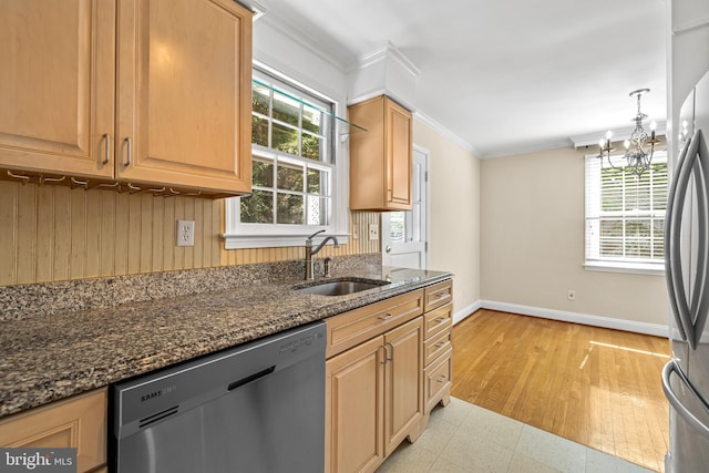 1516 Berwick Rd, Baltimore, MD 21204 - kitchen with stainless steel appliances, ornamental molding, dark stone countertops, a chandelier, and light flooring