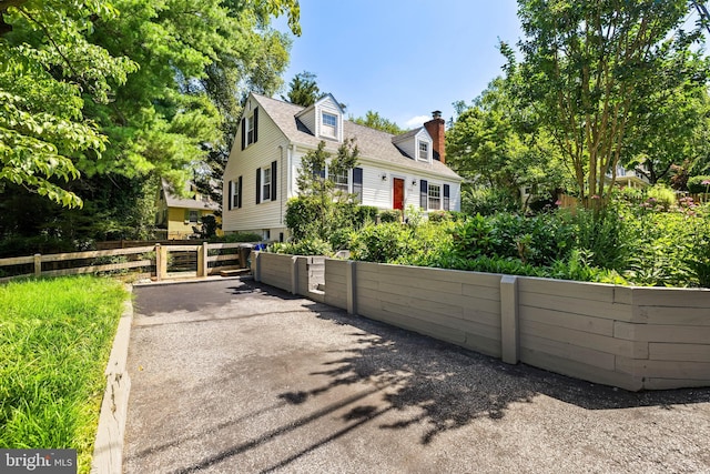 1516 Berwick Rd, Baltimore, MD 21204 - view of front facade with a chimney, a gate, and roof with shingles