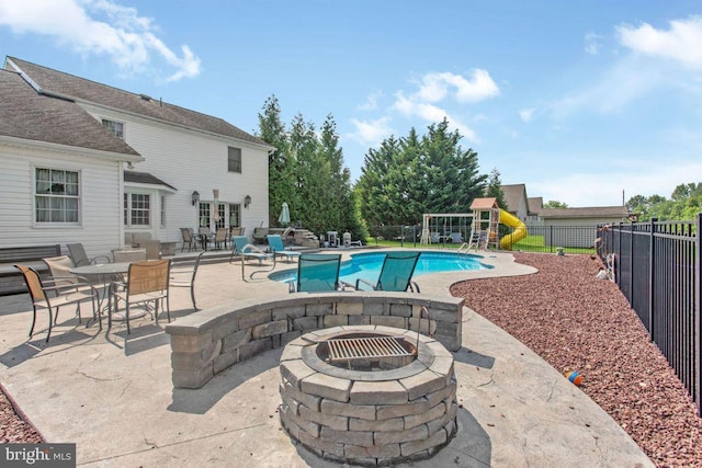 148 S Allwood Dr, Hanover, PA 17331 - view of pool featuring an outdoor fire pit, a patio area, and a playground