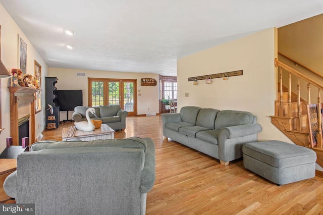 148 S Allwood Dr, Hanover, PA 17331 - living area featuring light wood-style flooring, stairway, and a glass covered fireplace