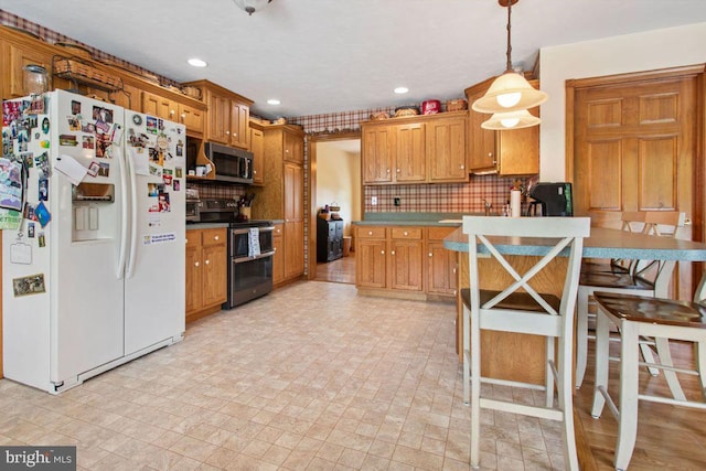 148 S Allwood Dr, Hanover, PA 17331 - kitchen featuring stainless steel appliances, tasteful backsplash, recessed lighting, decorative light fixtures, and brown cabinetry