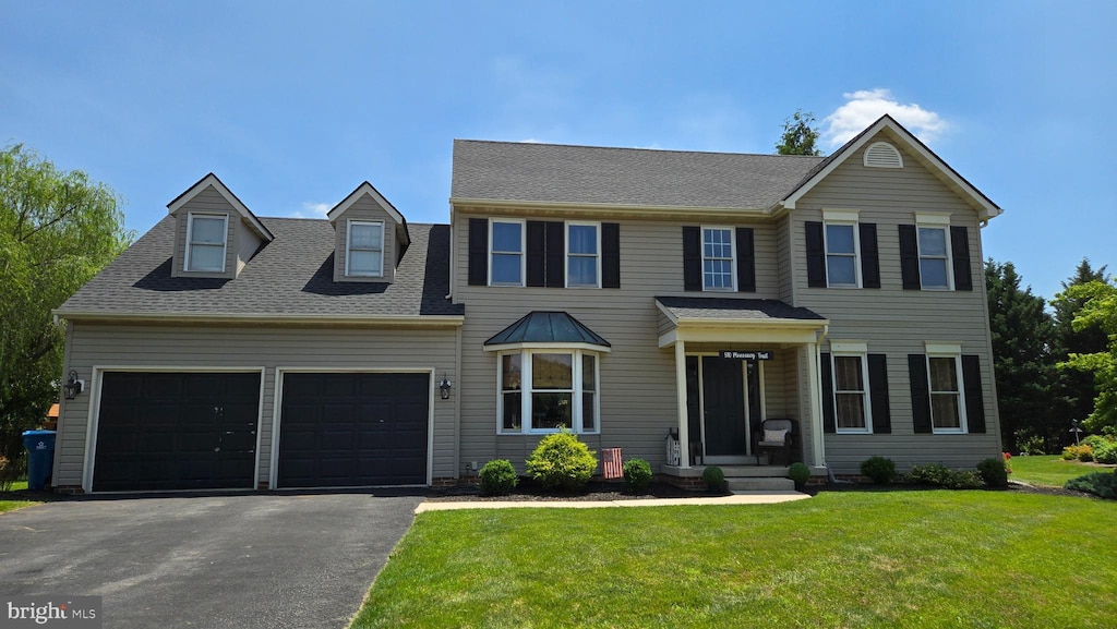 510 Monocacy Trl, Spring Grove, PA 17362 - view of front facade featuring driveway, a front yard, an attached garage, and roof with shingles