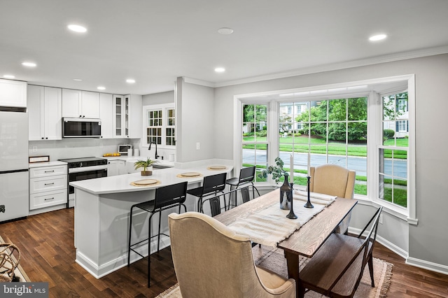 320 Redwood Grove Ct, Millersville, MD 21108 - dining area featuring crown molding, dark wood finished floors, and recessed lighting