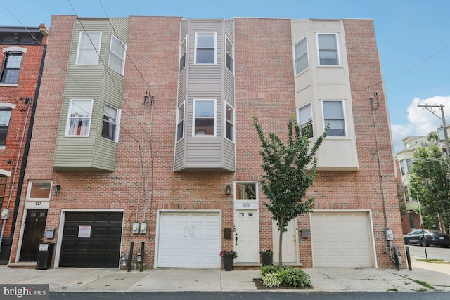 929 S 18th St, Philadelphia, PA 19146 - view of building exterior with a garage and driveway