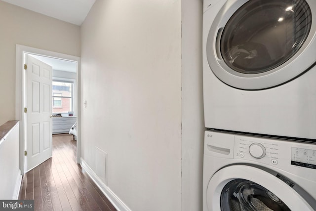 929 S 18th St, Philadelphia, PA 19146 - laundry room with stacked washer / dryer and dark wood-style floors